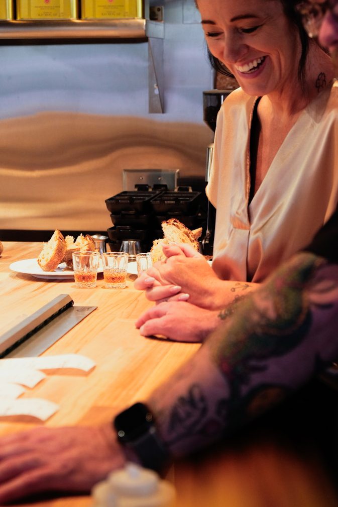 A warm moment at the bar at Olive & May
